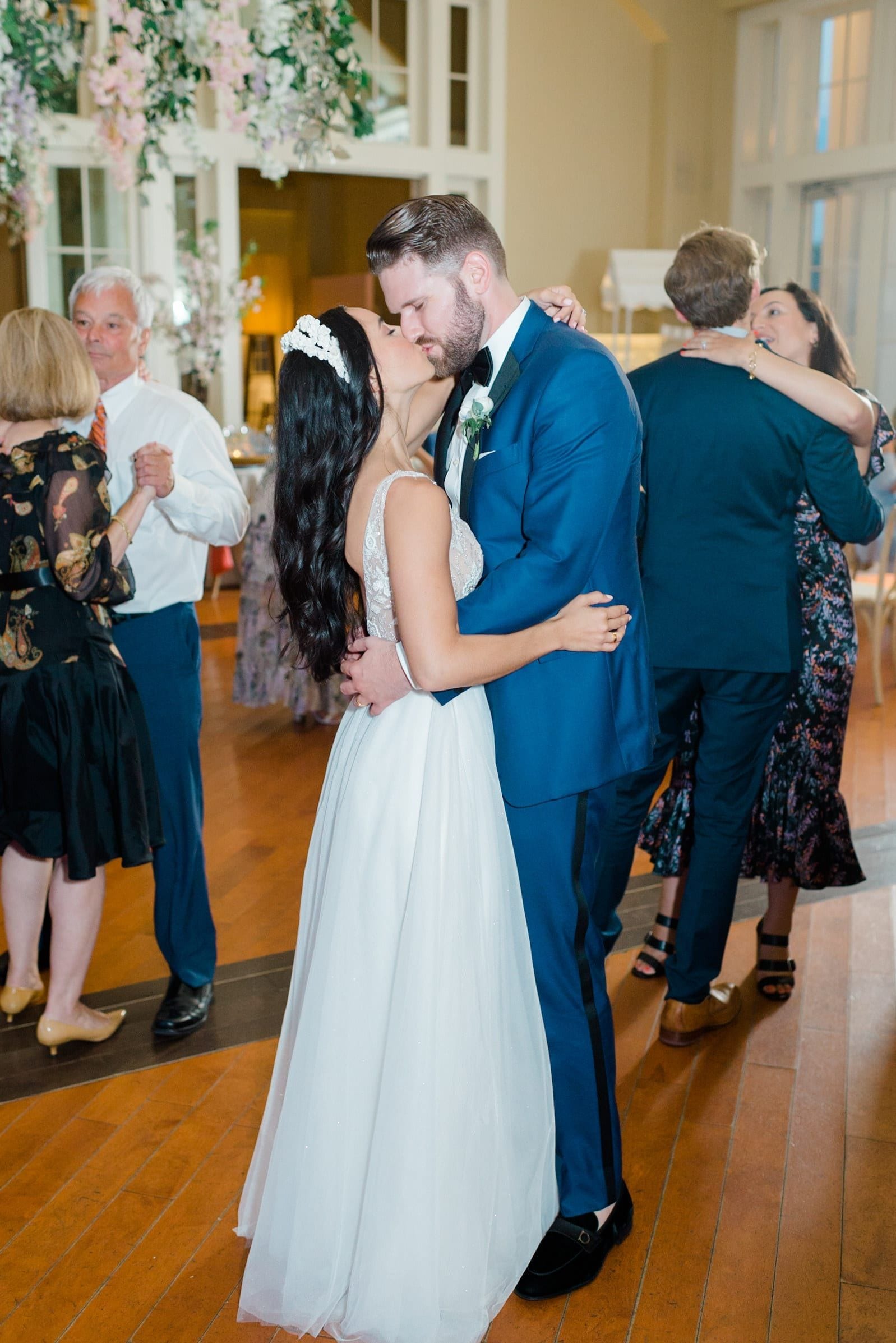 Couple sharing a kiss on the dance floor at The Ryland Inn